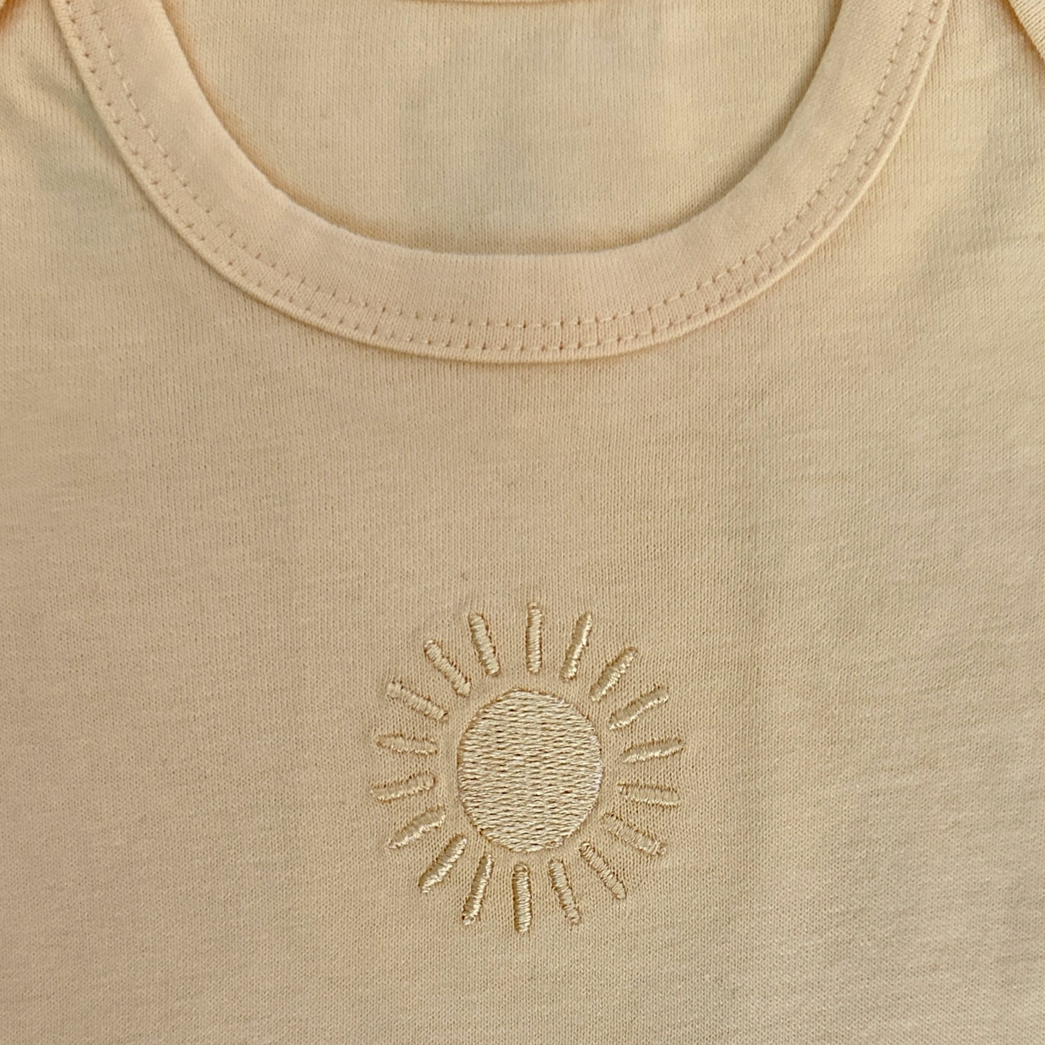 Romper Apricot Glow with embroidery
